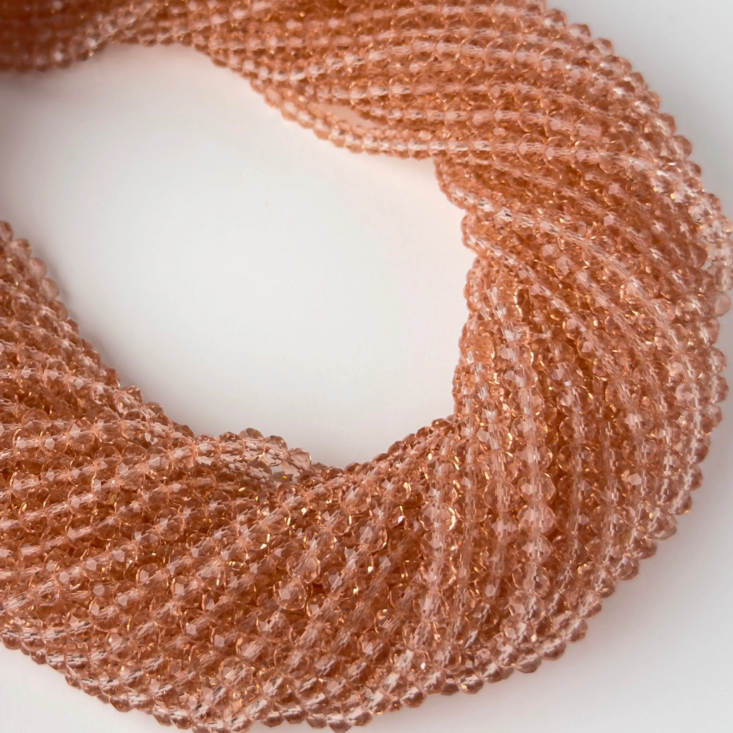 Antikrosa klare Rondella-Kristalle 4 x 3 mm – 10 Stränge | Sarobidi