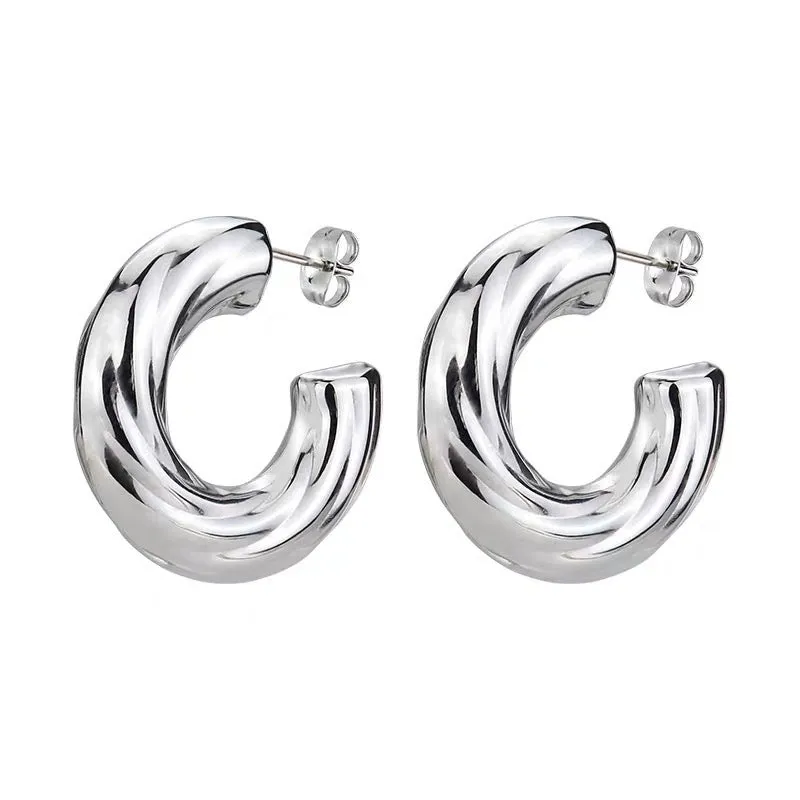 Orecchini a cerchio in acciaio dorato Torcion