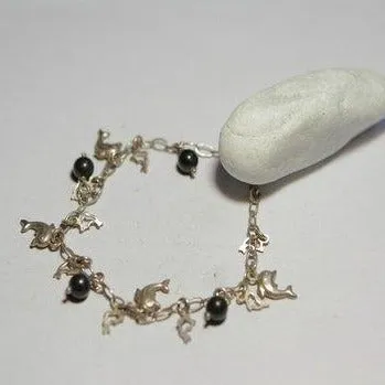 Bronzearmband mit Delfinen