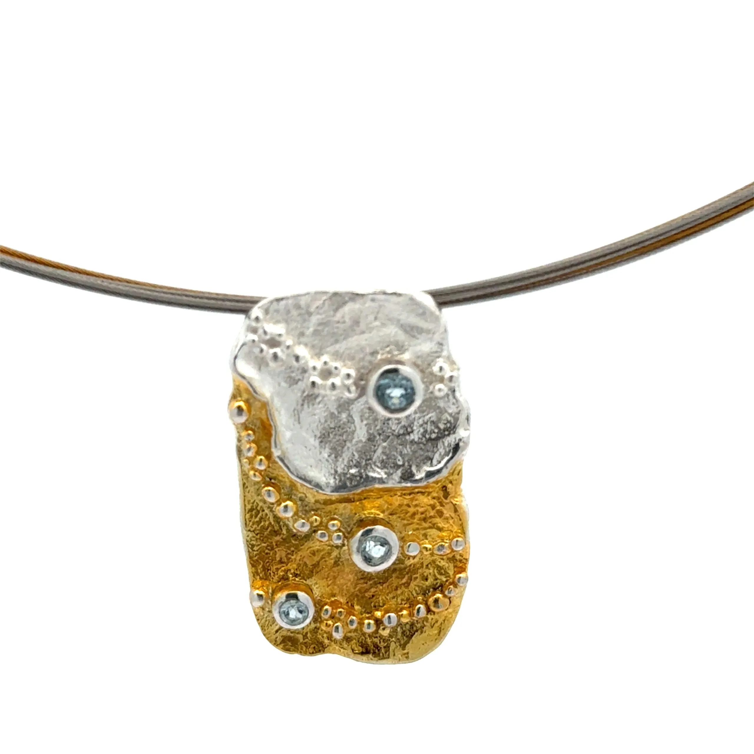 Ciondolo in argento e argento placcato oro con topazio celeste e anello multifilare